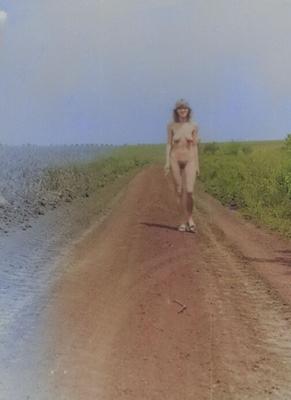 Retro soviet girl flashing in nature