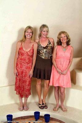 three matures pose together